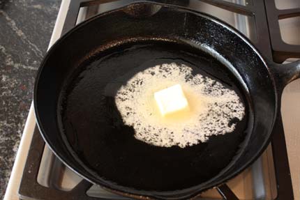 Melting butter in a cast iron pan on the stovetop | Artisan Bread in Five Minutes a Day