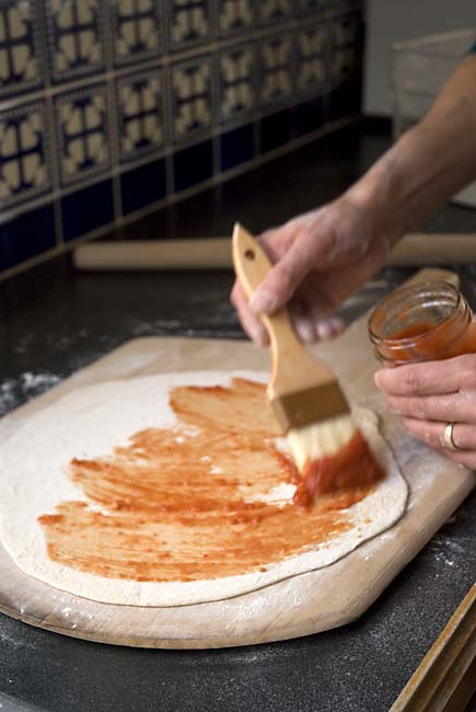 Minimal sauce on cracker-crust pizza